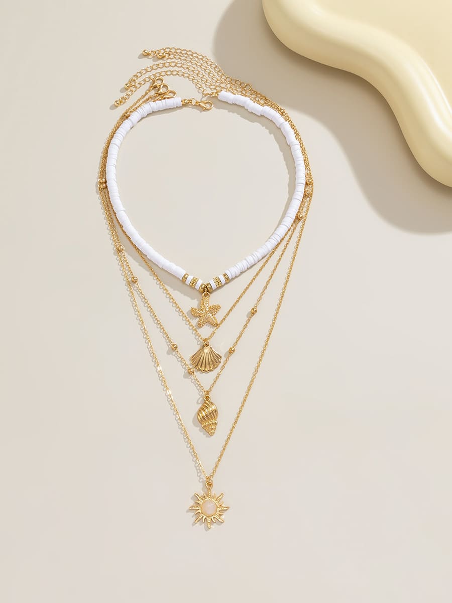 ZUZANA | Náhrdelník se hvězdicí z jižního Pacifiku, vícevrstvý, zlatý